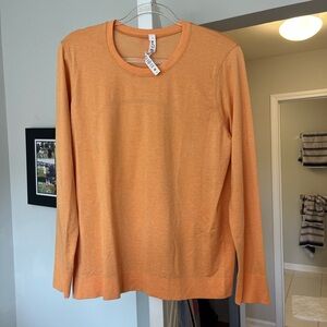 Gently used Lululemon orange long sleeve shirt!